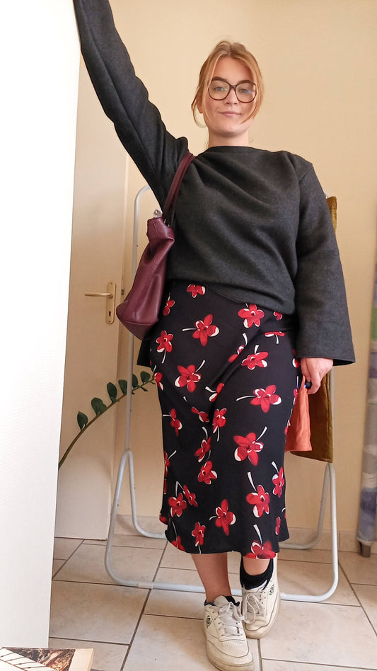 Black skirt with flowing red flowers